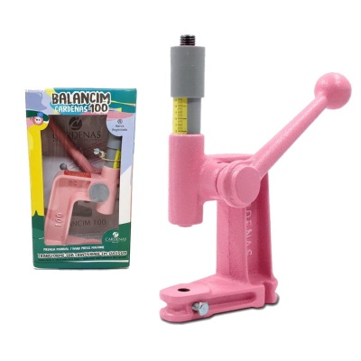 Prensa manual rosa com alavanca e embalagem ao lado