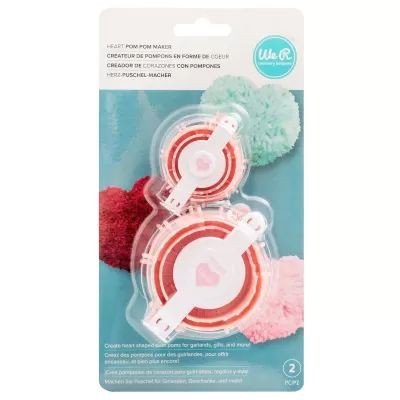 Kit para fazer pompons em forma de coração com componentes em plástico em embalagem azul