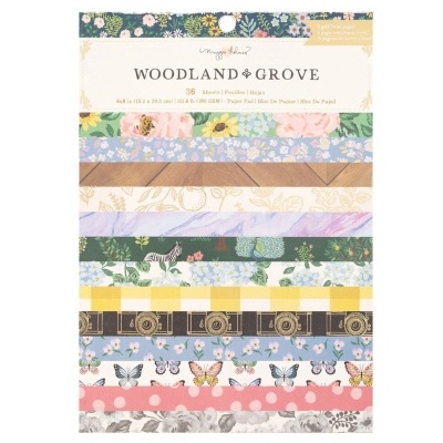 Folhas de papel decorativo com vários padrões e cores, embalagem com etiqueta 'WOODLAND GROVE'.