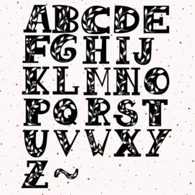 Alfabeto maiúsculo preto com padrão de folhas em fundo branco com pontos rosa