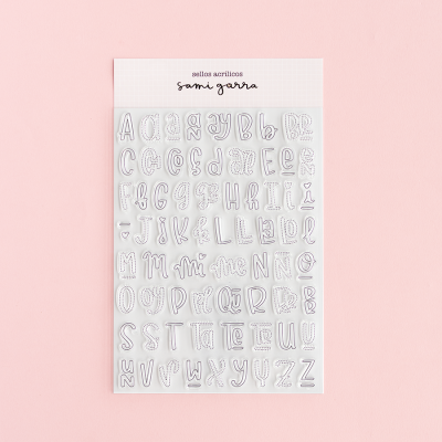 Conjunto de selos acrílicos com letras do alfabeto sobre fundo rosa