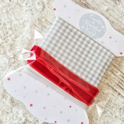 Conjunto de fitas decorativas embaladas em cartão com texto Coração de Natal