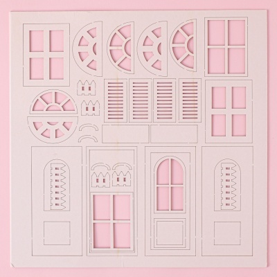 Relevo de janelas e portas recortadas em papel branco com fundo rosa