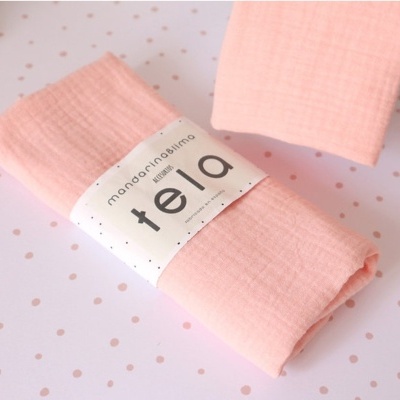 Tecido rosa claro com etiqueta mandarina bimbi tela