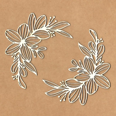 Recortes decorativos brancos de flores e folhas sobre fundo castanho