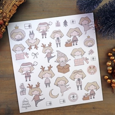 Folha decorativa com desenhos de personagens natalícias e símbolos de Natal