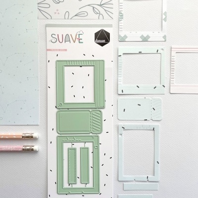 Conjunto de moldes de recorte em metal verde em embalagem branca com padrão preto e texto SUAVE e dazzles, lápis rosa e branco