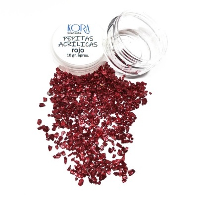 Frasco aberto com pépitas acrílicas vermelhas e rótulo com texto