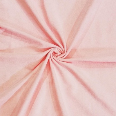 Tecido cor-de-rosa claro com textura suave arranjado em espiral
