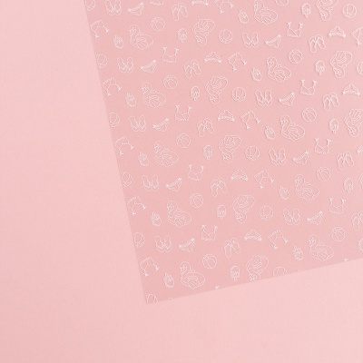 Folha de papel rosa com ilustrações brancas em padrão