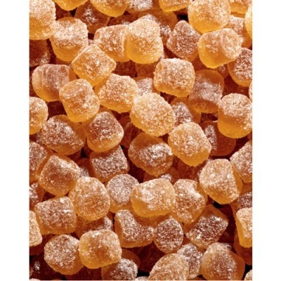 Balas ou gomas cor de âmbar com cobertura de açúcar cristalizado