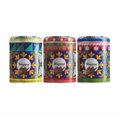 Três latas decorativas coloridas da marca Vergani com padrões florais e geométricos