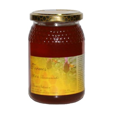 Frasco de mel com tampa metálica e rótulo amarelo com abelhas