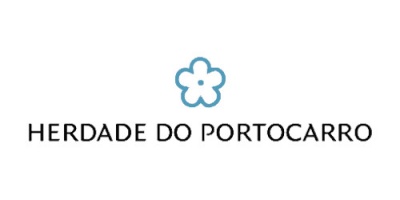 Logótipo Herdade do Portocarro com flor azul