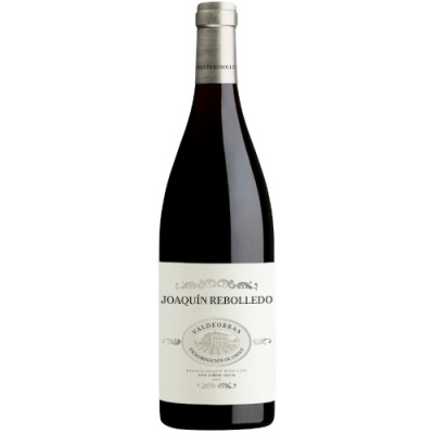 Garrafa de vinho tinto Joaquín Rebolledo com rótulo branco e tampa prateada.