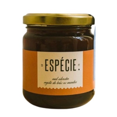 Frasco de vidro com mel silvestre e rótulo laranja