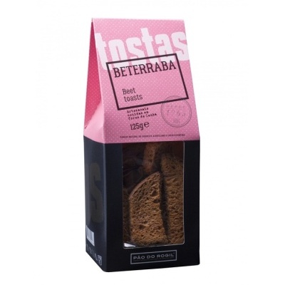 Embalagem rosa e preta de tostas de beterraba com janela transparente mostrando o produto