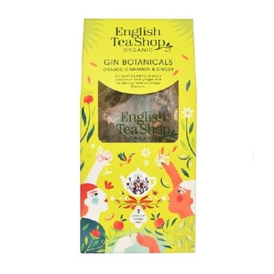 Pacote amarelo de chá orgânico English Tea Shop com ilustrações coloridas e texto em inglês