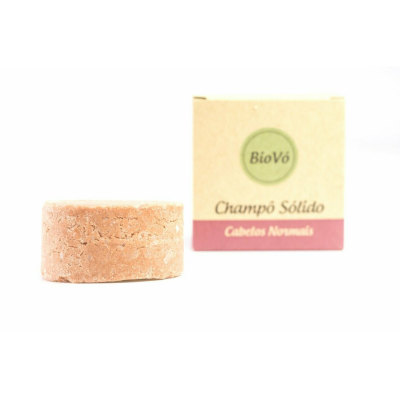 Champô sólido redondo bege ao lado da embalagem de papel com texto BioVó, Champô Sólido, Cabelos Normais