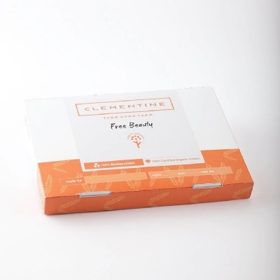 Caixa branca e laranja de papel para produto Clementine Free Beauty