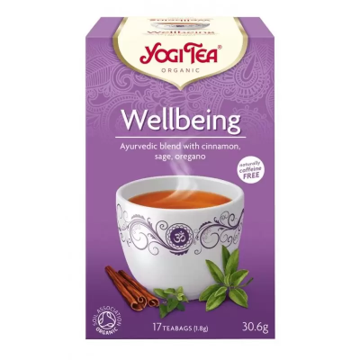 Caixa lilás de chá Yogi Tea Organic Wellbeing com chávena branca decorada e ingredientes