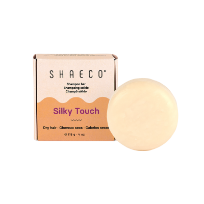 Shampoo sólido SHAeco Silky Touch para cabelos secos com embalagem de cartão e barra redonda creme
