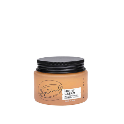 Frasco de creme de noite UpCircle cor de pele-alaranjada com tampa preta e etiqueta branca