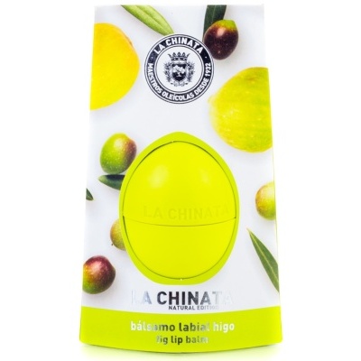 Bálsamo labial com embalagem branca e verde decorada com imagens de figos e folhas.