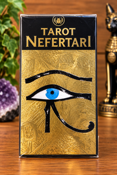 Caixa do Tarot Nefertari dourada e preta com olho azul estilizado