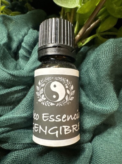 Frasco de óleo essencial de gengibre com rótulo preto e símbolo yin-yang