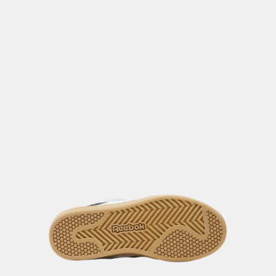 Sola de sapatilha Reebok cor bege com padrão antiderrapante