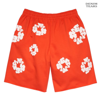 Calções laranja com flores brancas e texto DENIM TEARS no canto superior direito