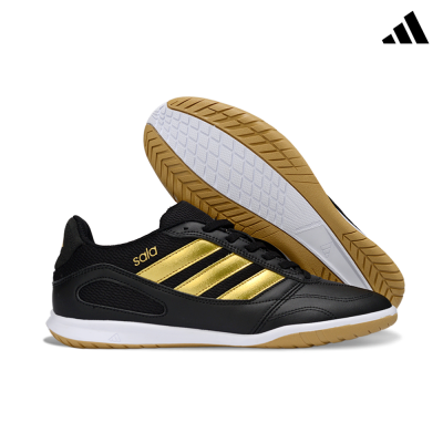 Ténis desportivos pretos e dourados com sola branca e castanha