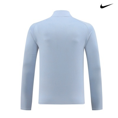 Camisa de manga comprida azul clara da Nike vista de costas