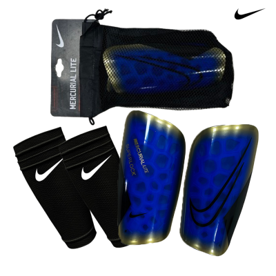 Caneleiras Nike Mercurial Lite Superlock azuis e douradas com rede preta de embalagem