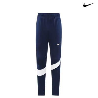 Calças de treino azul escuro com faixa branca e logótipo Nike