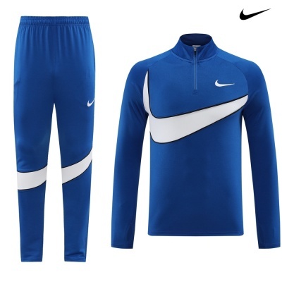 Conjunto desportivo Nike azul com recortes brancos e pretos: calças e camisola de manga comprida com fecho.