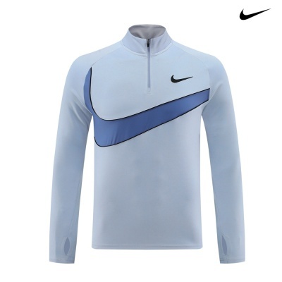 Camisola desportiva Nike azul clara com padrão e fecho meio zip