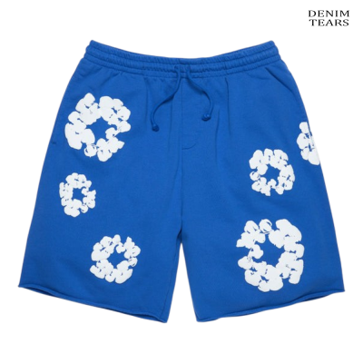 Calções azuis com estampas brancas de flores, cordão na cintura, texto DENIM TEARS no canto superior direito