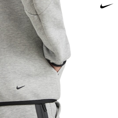 Roupa desportiva cinzenta com símbolo Nike