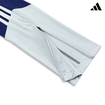 Manga azul claro e azul escuro com fecho e riscas brancas da Adidas