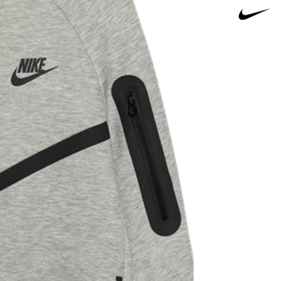 Detalhe de casaco cinzento com bolso e logo Nike preto