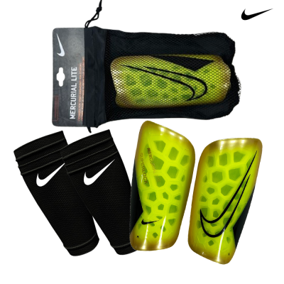 Caneleiras Nike Mercurial Lite amarelas com proteções pretas e embalagem em rede