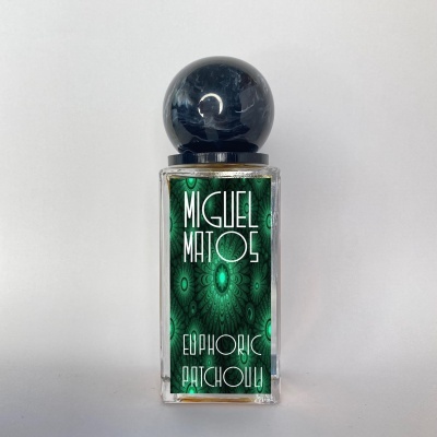 Frasco de perfume Miguel Matos Euphoric Patchouli com tampa preta e etiqueta verde