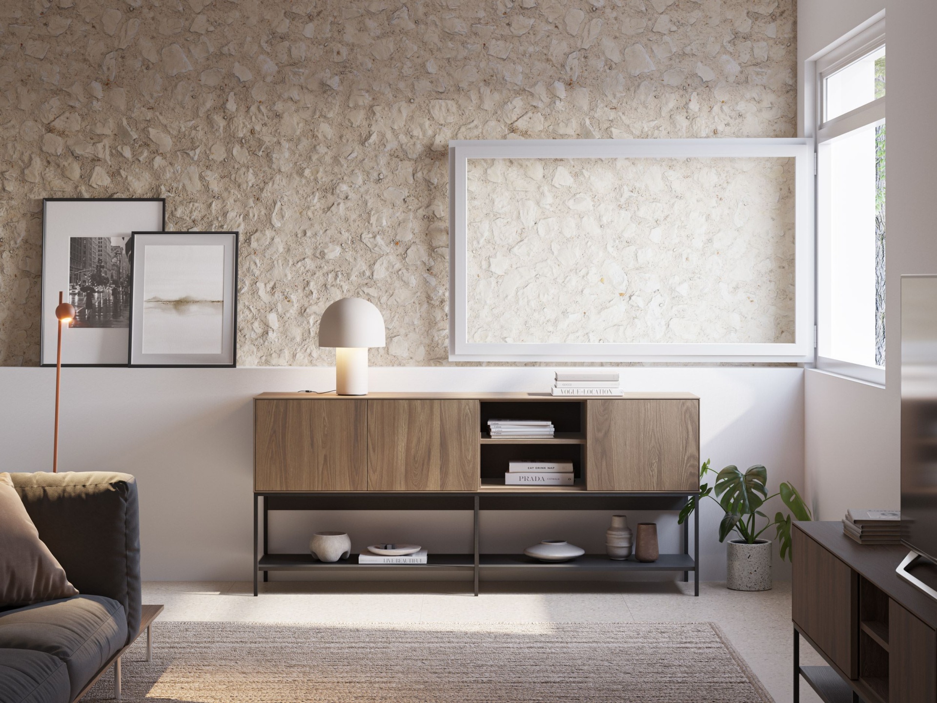 Aparador com 3 Portas | Design Moderno em Madeira e Metal Aparador em madeira clara com base preta, candeeiro branco, livros, quadros e parede de pedra