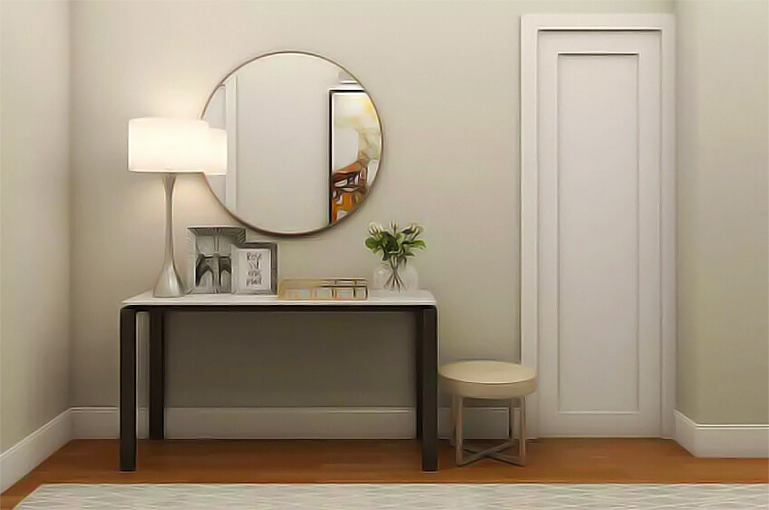 Consola preta com tampo branco, espelho redondo, candeeiro, moldura, vaso com flores e banco redondo num ambiente interior