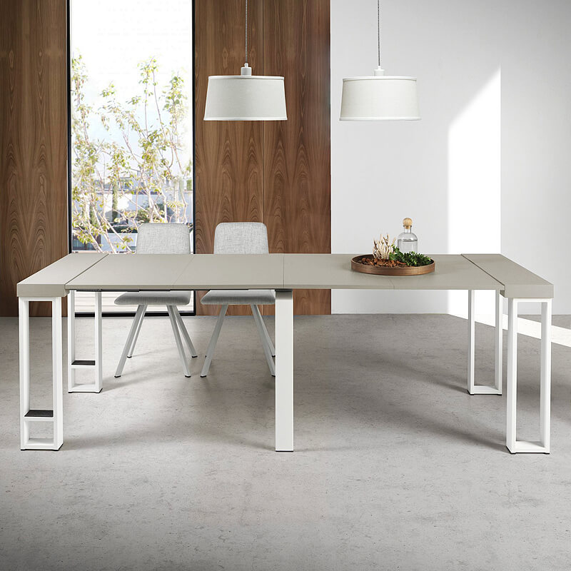 Mesa de Jantar / Consola Extensível Pinald Mesa retangular cinza claro com pernas brancas metálicas, cadeiras cinzentas, luminárias brancas pendentes