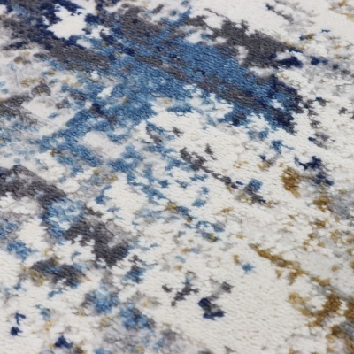 Tecido ou tapete com padrão abstrato em tons de azul, cinza, branco e bege