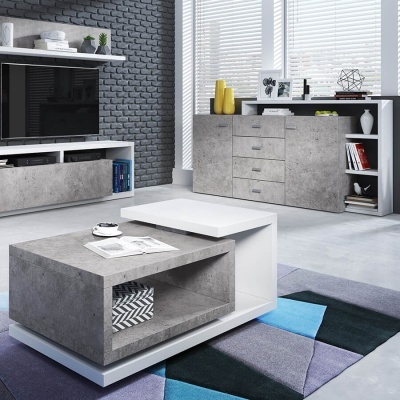 Conjunto de mesa de centro e móvel para TV cinza cimento com detalhes brancos em sala moderna com parede de tijolo cinza.