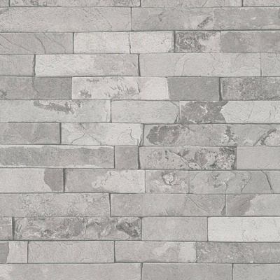 Parede de tijolos cinza com textura rugosa